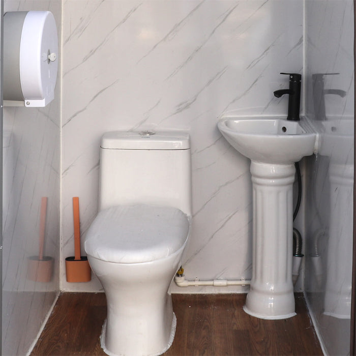 TMG FTS04 4ft portable washroom with ceramic toilet, triangular sink, solar powered exhaust fan, steel frame, EPS wall panels, and PVC wood grain floor