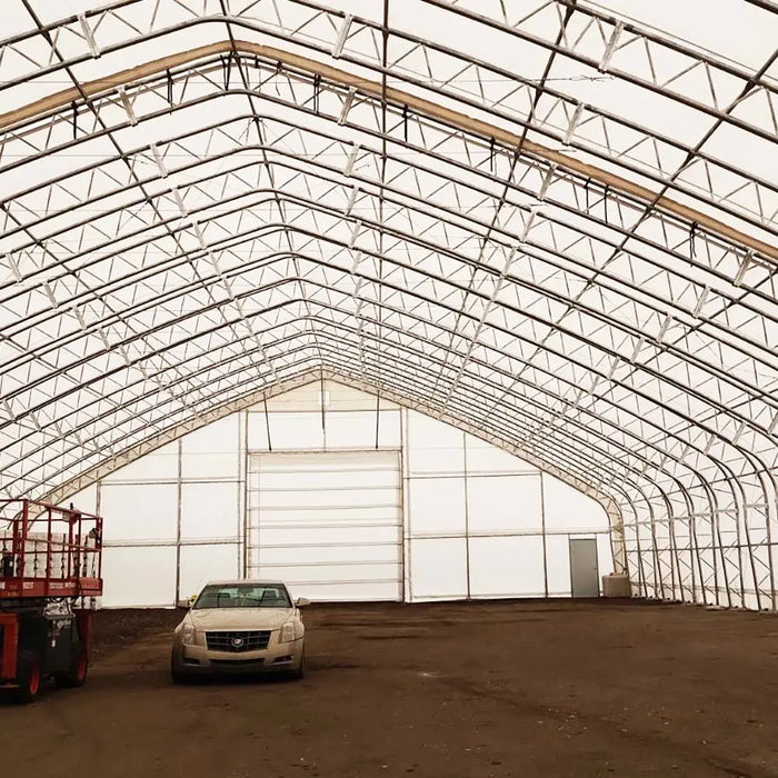 TMG Industrial Pro Series 70' x 100' Dual Truss Storage Shelter with Heavy Duty 32 oz PVC Cover & Drive Through Doors, TMG-DT70100-PRO