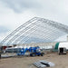 TMG Industrial Pro Series 70' x 100' Dual Truss Storage Shelter with Heavy Duty 32 oz PVC Cover & Drive Through Doors, TMG-DT70100-PRO