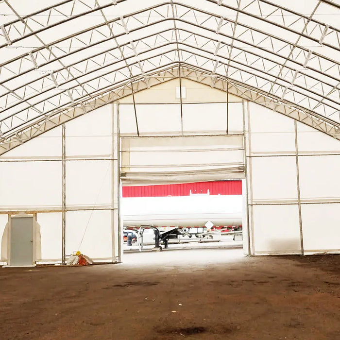 TMG Industrial Pro Series 70' x 120' Dual Truss Storage Shelter with Heavy Duty 32 oz PVC Cover & Drive Through Doors, TMG-DT70120-PRO