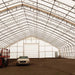 TMG Industrial Pro Series 70' x 120' Dual Truss Storage Shelter with Heavy Duty 32 oz PVC Cover & Drive Through Doors, TMG-DT70120-PRO