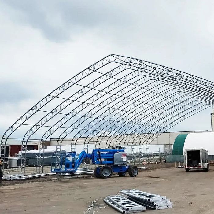 TMG Industrial Pro Series 70' x 120' Dual Truss Storage Shelter with Heavy Duty 32 oz PVC Cover & Drive Through Doors, TMG-DT70120-PRO